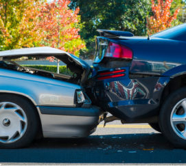 Auto accident involving two cars on a city street
