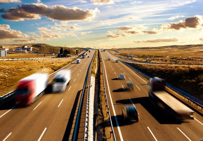 trucks and cars on a freeway