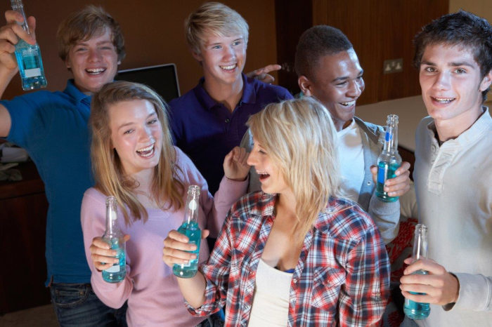 Teens at a party drinking