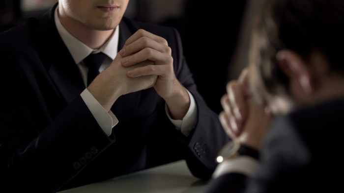 Man with hands folded