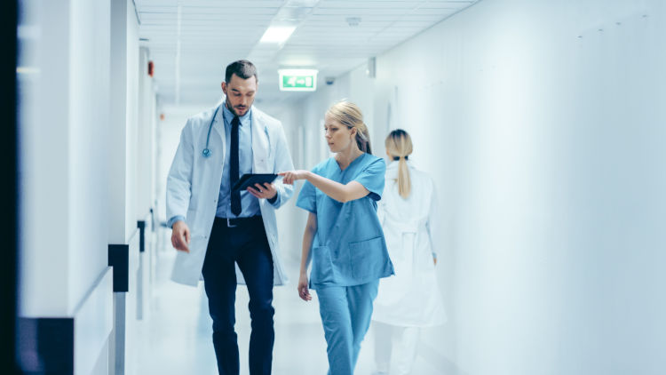 Doctor and nurse in hallway