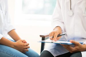 A doctor discussing a medical evaluation with a patient