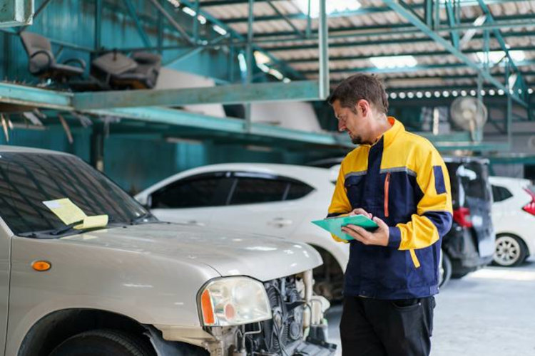 Man inspecting car damage